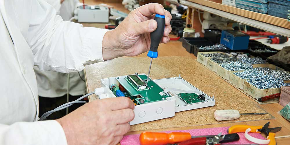 photo of man making a rf power supply